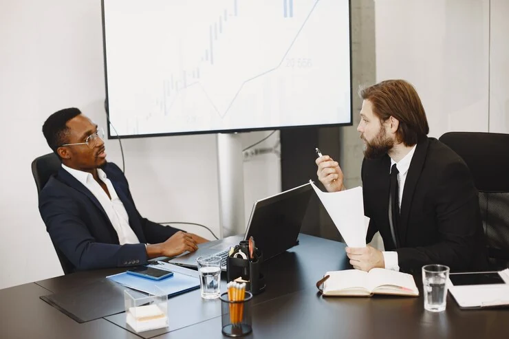 Pearl Lemon executives in a high-level sales performance review meeting discussing growth charts.